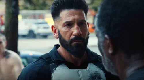 assets/frank-castle-listenening-to-a-heartbroken-civilian-in-punisher-one-last-kill-1.jpeg
