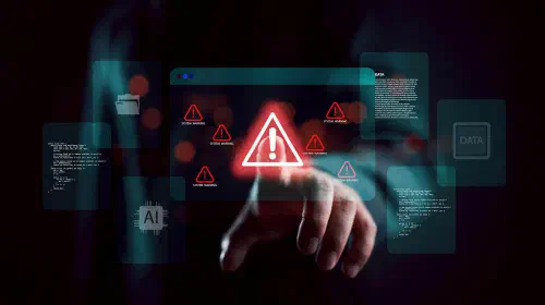 assets/Security-warning-alert-with-shadowy-scammer-hacker-in-darkness-1.jpeg