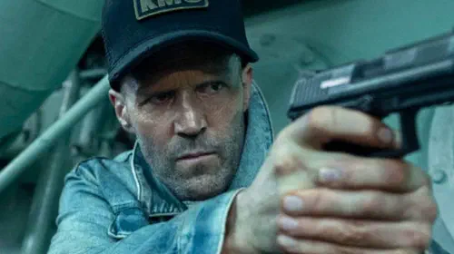 assets/jason-statham-holding-gun-in-mutiny.jpeg