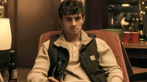 assets/michael-johnston-as-bear-frowning-while-holding-a-beer-in-obsession.jpeg