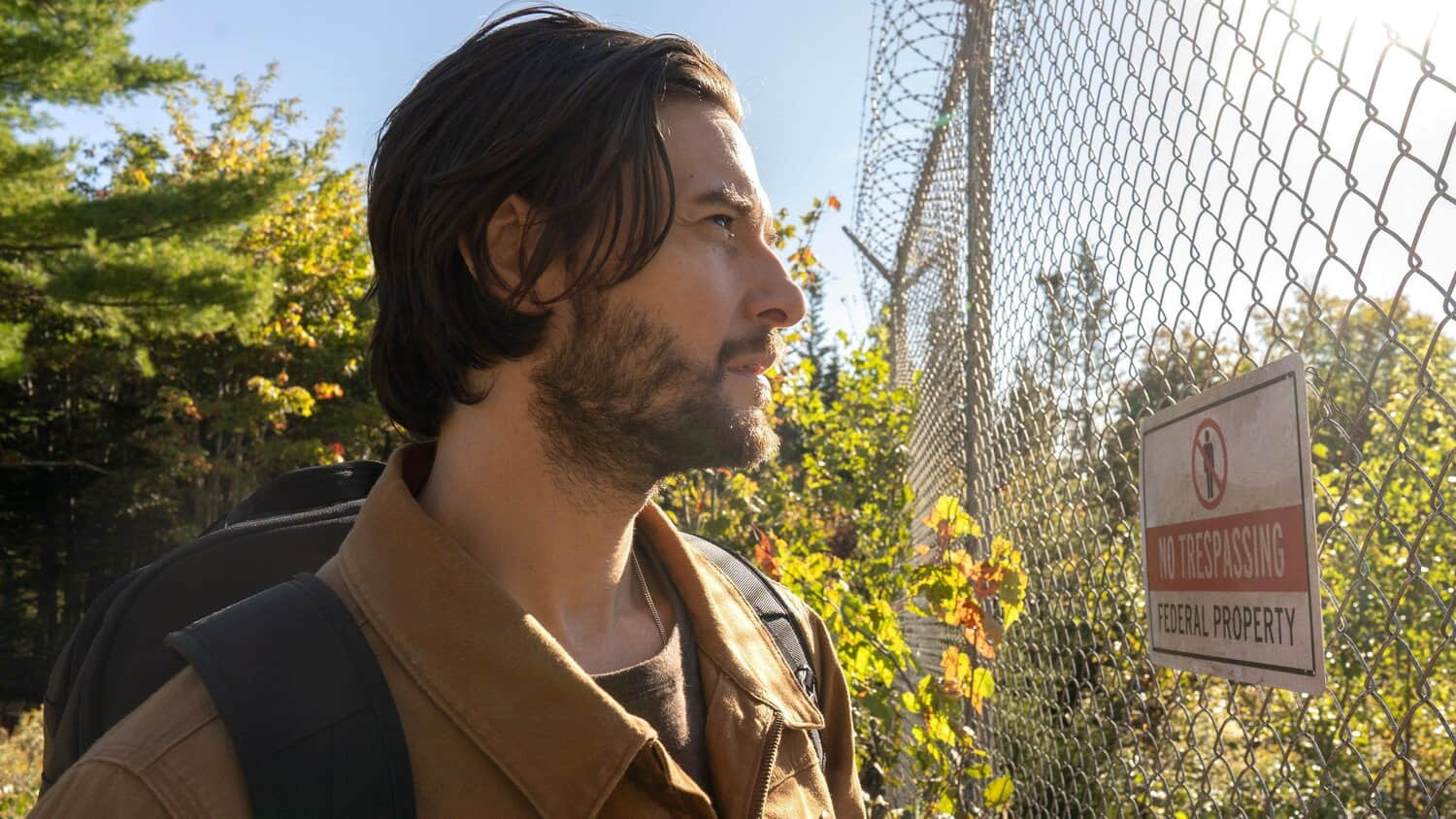 ben-barnes-as-tim-jamieson-looking-at-a-fence-in-the-institute.jpeg