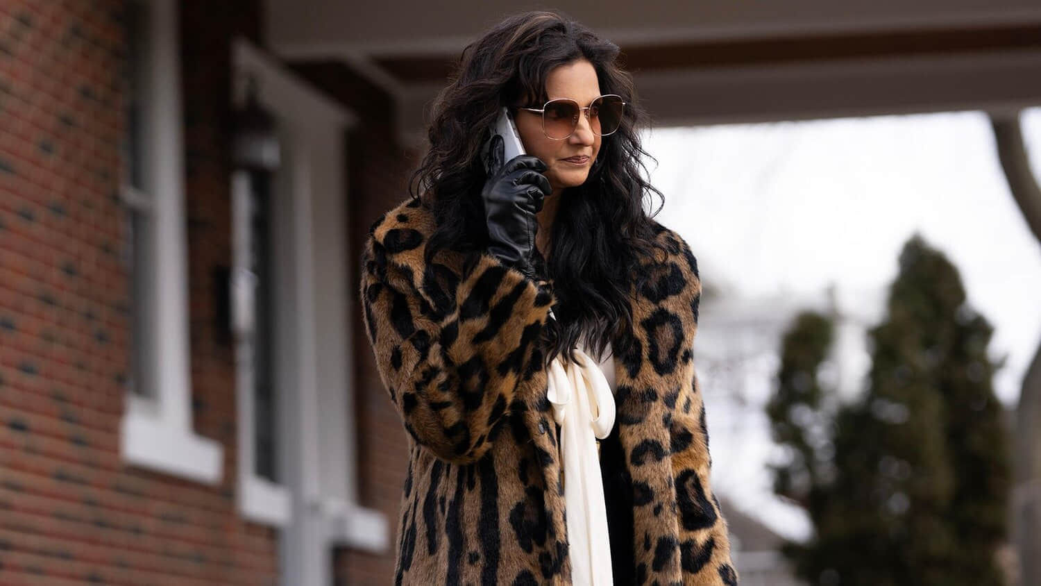 poorna-jagannathan-holding-a-phone-in-a-scene-from-deli-boys.jpeg
