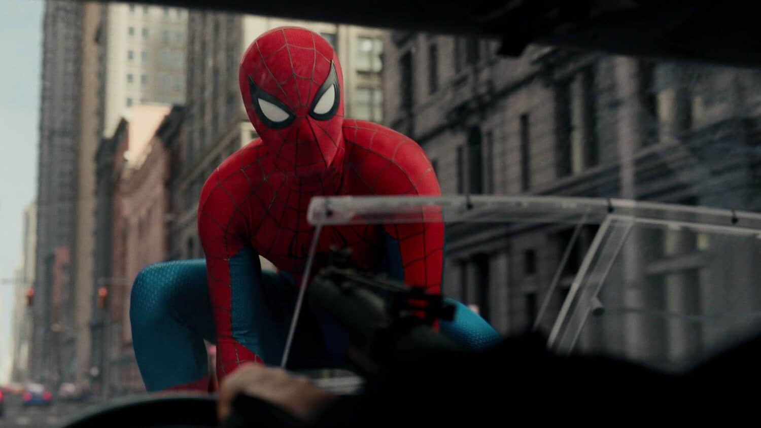 tom-holland-as-spider-man-sitting-on-the-hood-of-punisher-s-truck-in-spider-man-brand-new-day.jpeg