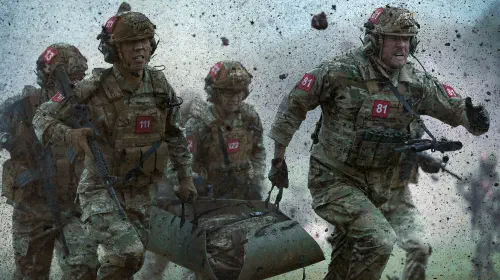 assets/alan-ritchson-leads-his-sqaudron-through-a-battlefield-in-war-machine.jpeg