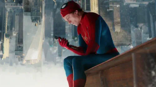 assets/tom-holland-s-peter-parker-watching-his-phone-for-news-in-spider-man-brand-new-day.jpeg