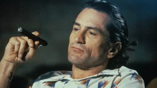 assets/robert-de-niro-with-a-cigar-as-max-cady-in-cape-fear-1.jpeg