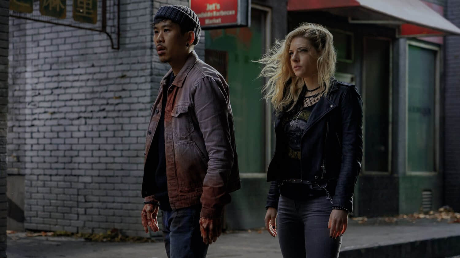 two-characters-stand-in-the-street-in-wu-assassins.jpeg