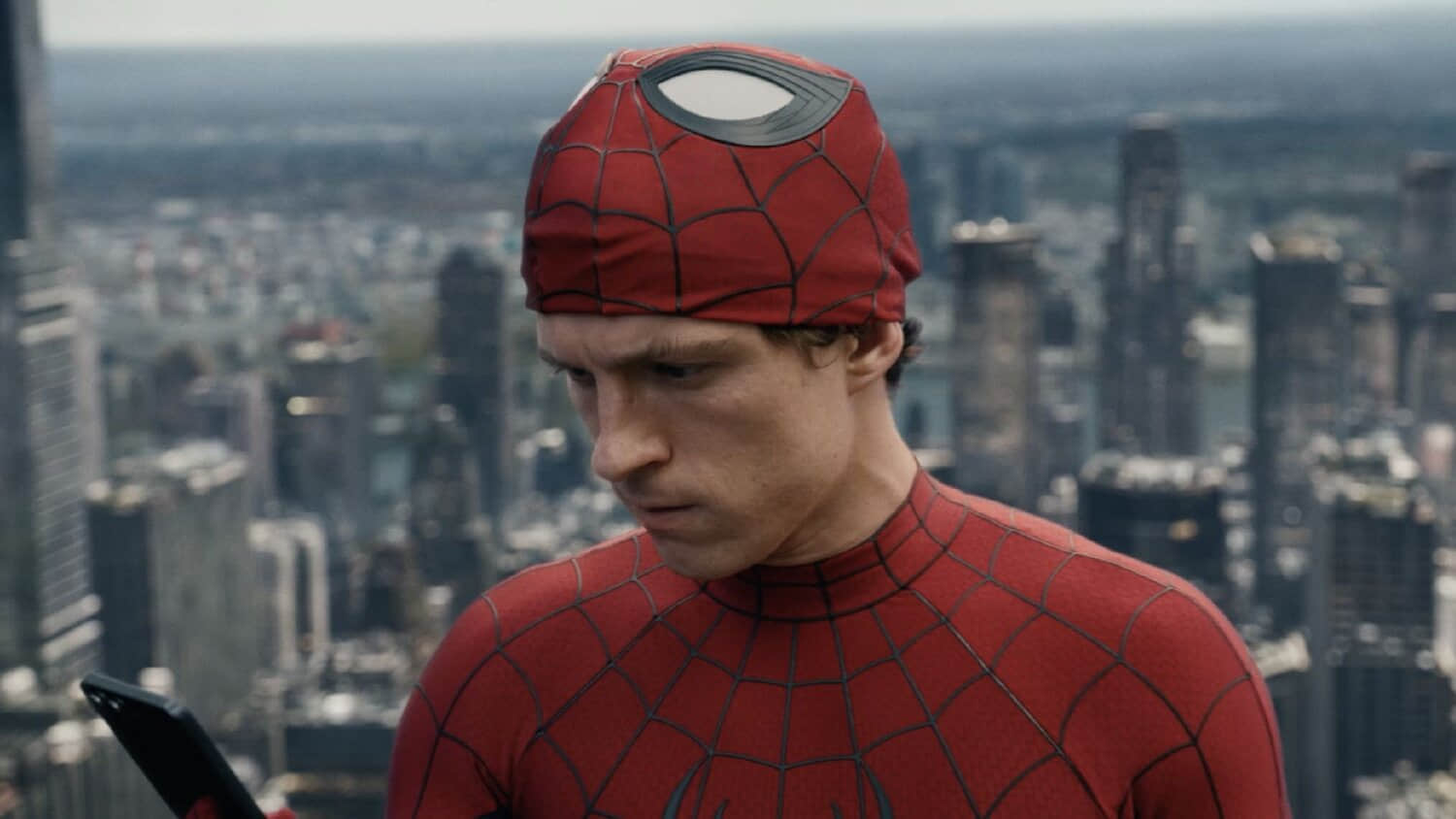 peter-parker-looking-at-his-phone-in-spider-man-brand-new-day.jpeg