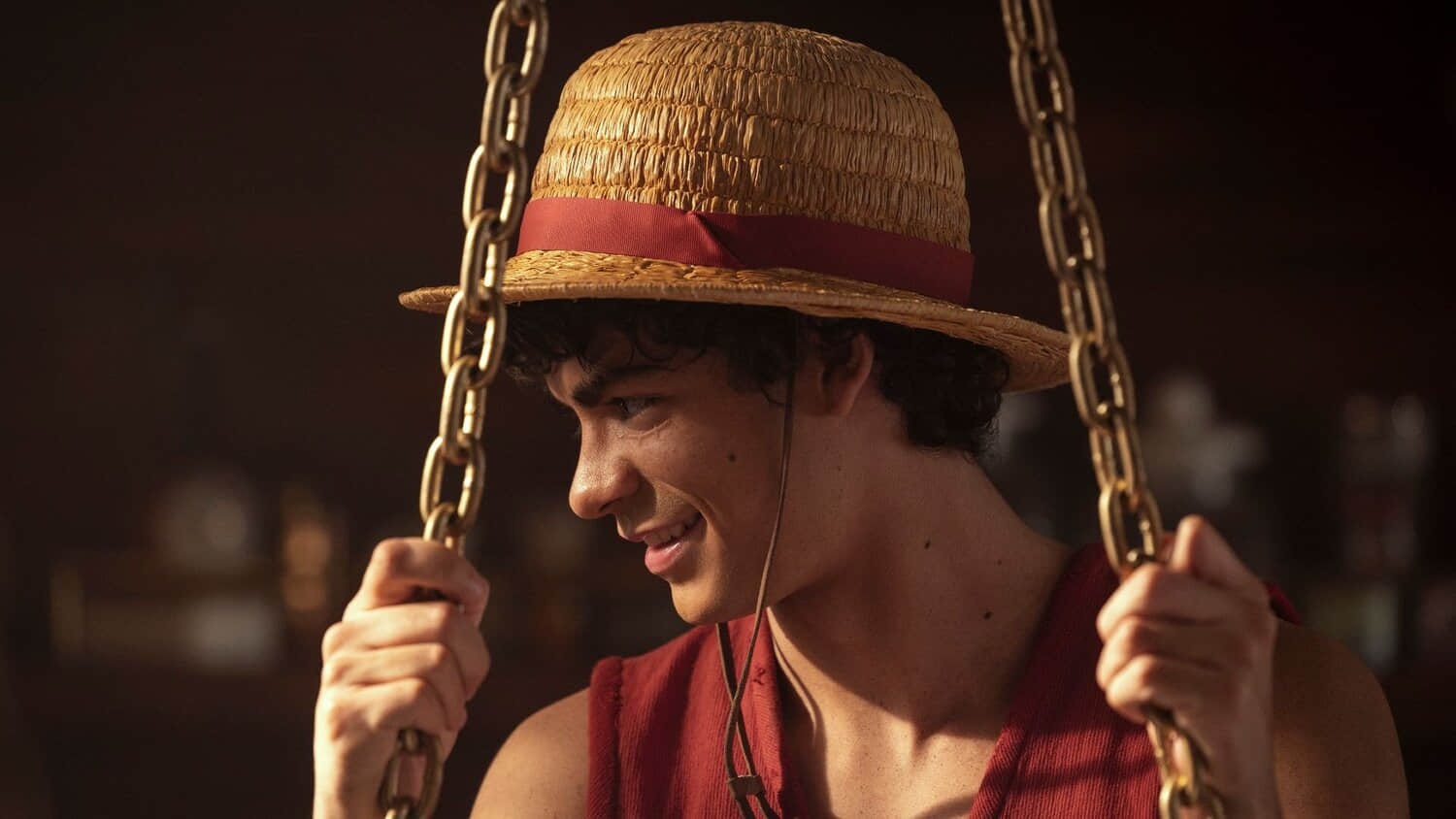 luffy-holding-onto-two-chains-looking-down-and-smiling-in-one-piece-season-2.jpeg