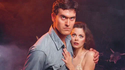 assets/bruce-campbell-and-bridget-hoffman-in-a-promo-shot-from-the-evil-dead.jpeg