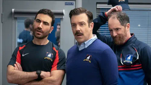 assets/brett-goldstein-as-roy-kent-jason-sudeikis-as-ted-lasso-and-brendan-hunt-as-coach-beard-in-ted-lasso.jpeg