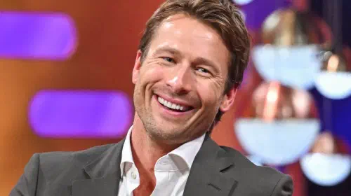 assets/glen-powell-smiling-on-the-graham-norton-show.jpeg