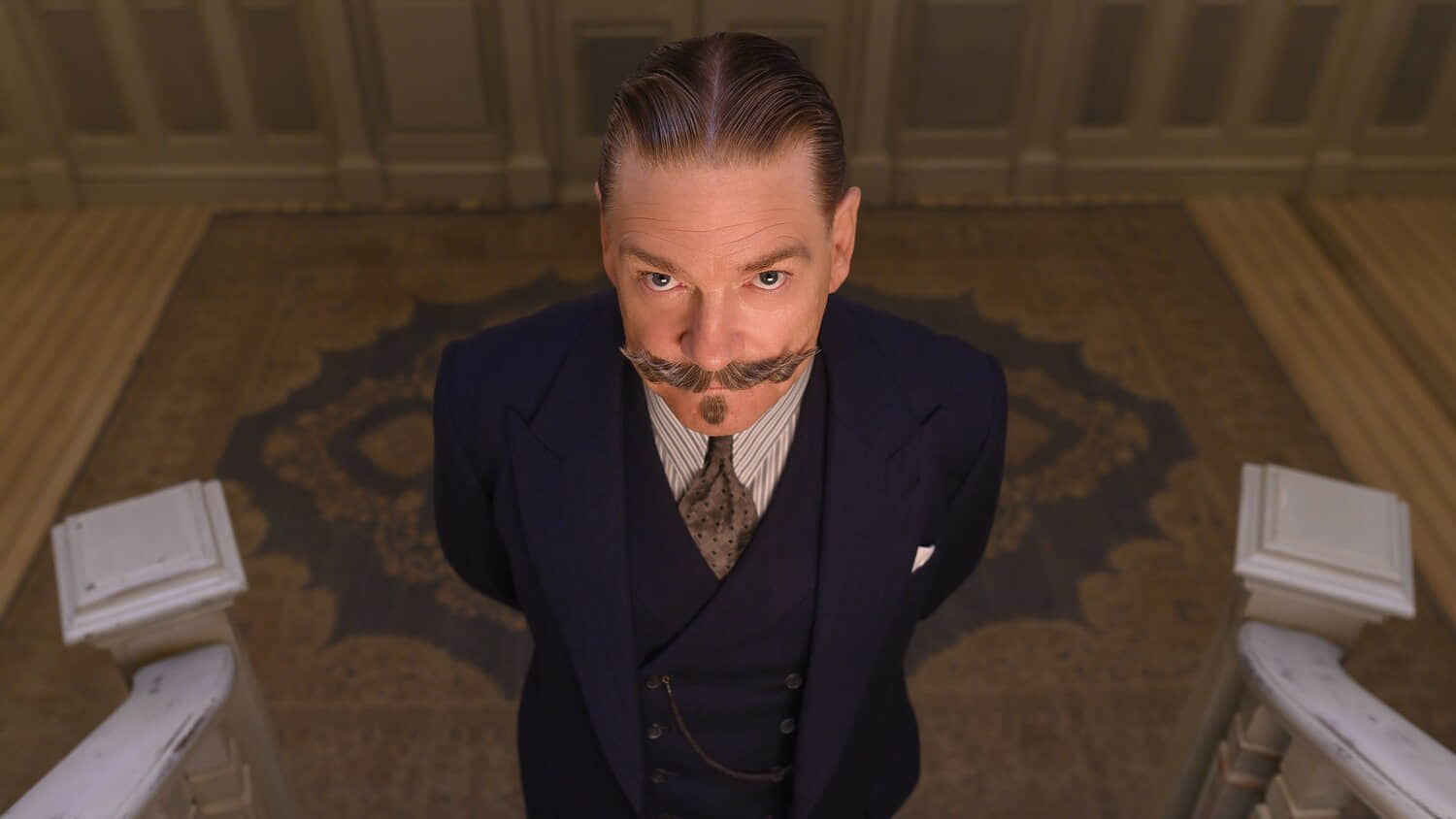 kenneth-branagh-as-hercule-poirot-looking-upwards-in-a-still-from-death-on-the-nile.jpeg