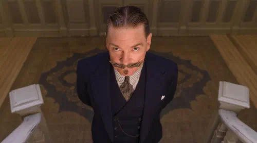 assets/kenneth-branagh-as-hercule-poirot-looking-upwards-in-a-still-from-death-on-the-nile.jpeg