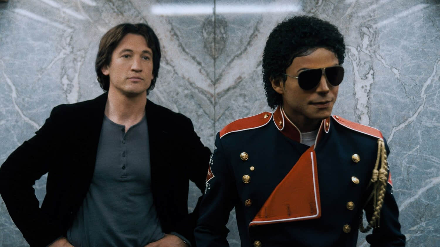 miles-teller-as-john-branca-and-jaafar-jackson-as-michael-jackson-in-michael.jpeg