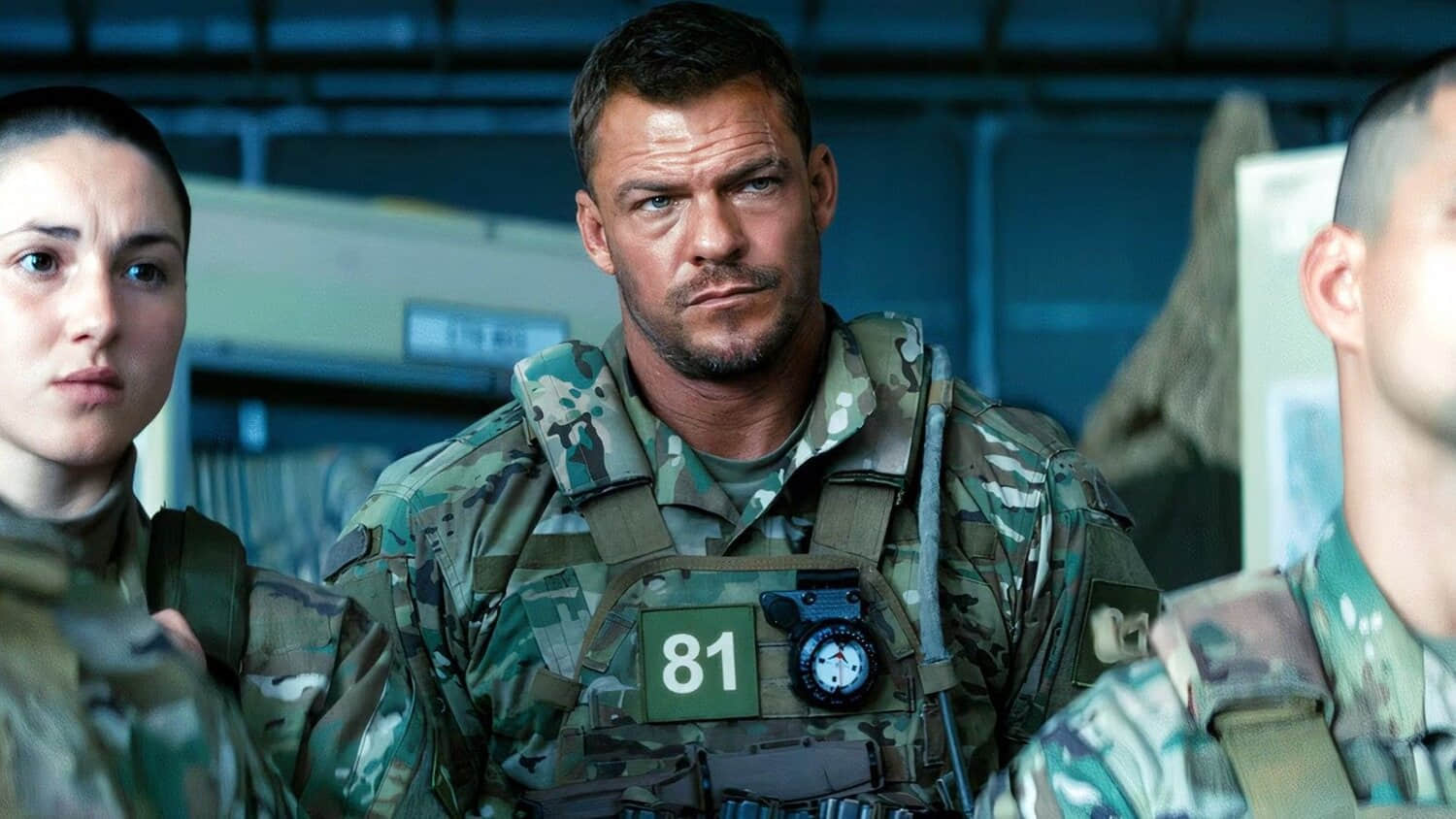 alan-ritchson-staring-while-listening-to-his-superiors-in-war-machine.jpeg