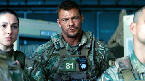 assets/alan-ritchson-staring-while-listening-to-his-superiors-in-war-machine.jpeg