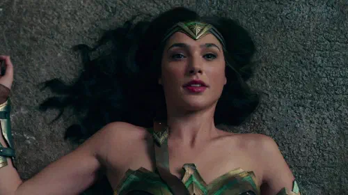 assets/gal-gadot-s-wonder-woman-on-the-floor-and-looking-stunned-in-justice-league.jpeg