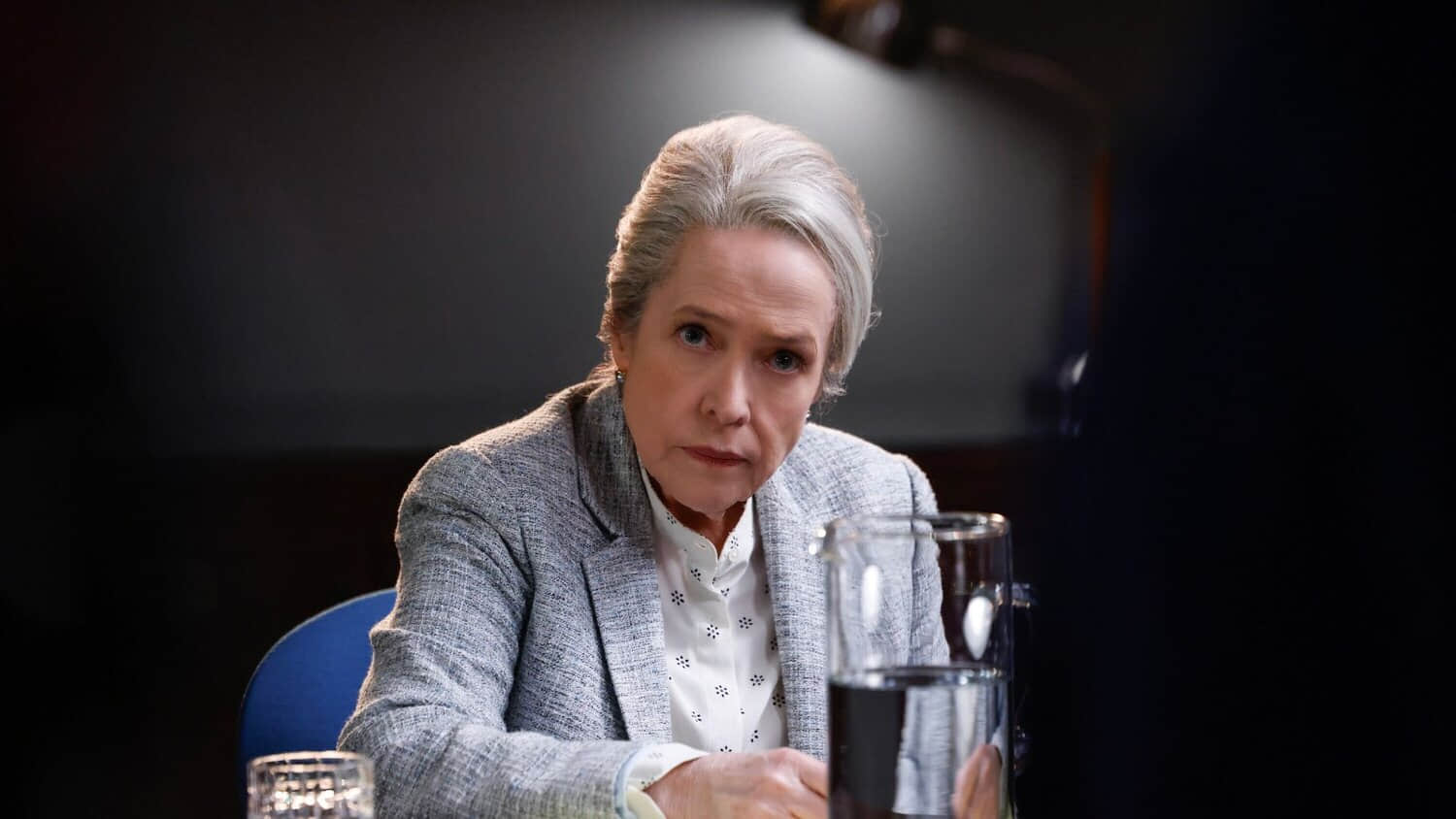 kathy-bates-sits-under-an-interrogation-light-looking-incredulous-in-matlock.jpeg