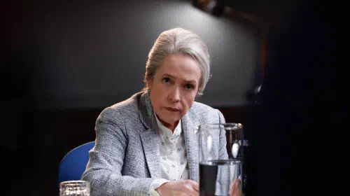 assets/kathy-bates-sits-under-an-interrogation-light-looking-incredulous-in-matlock.jpeg
