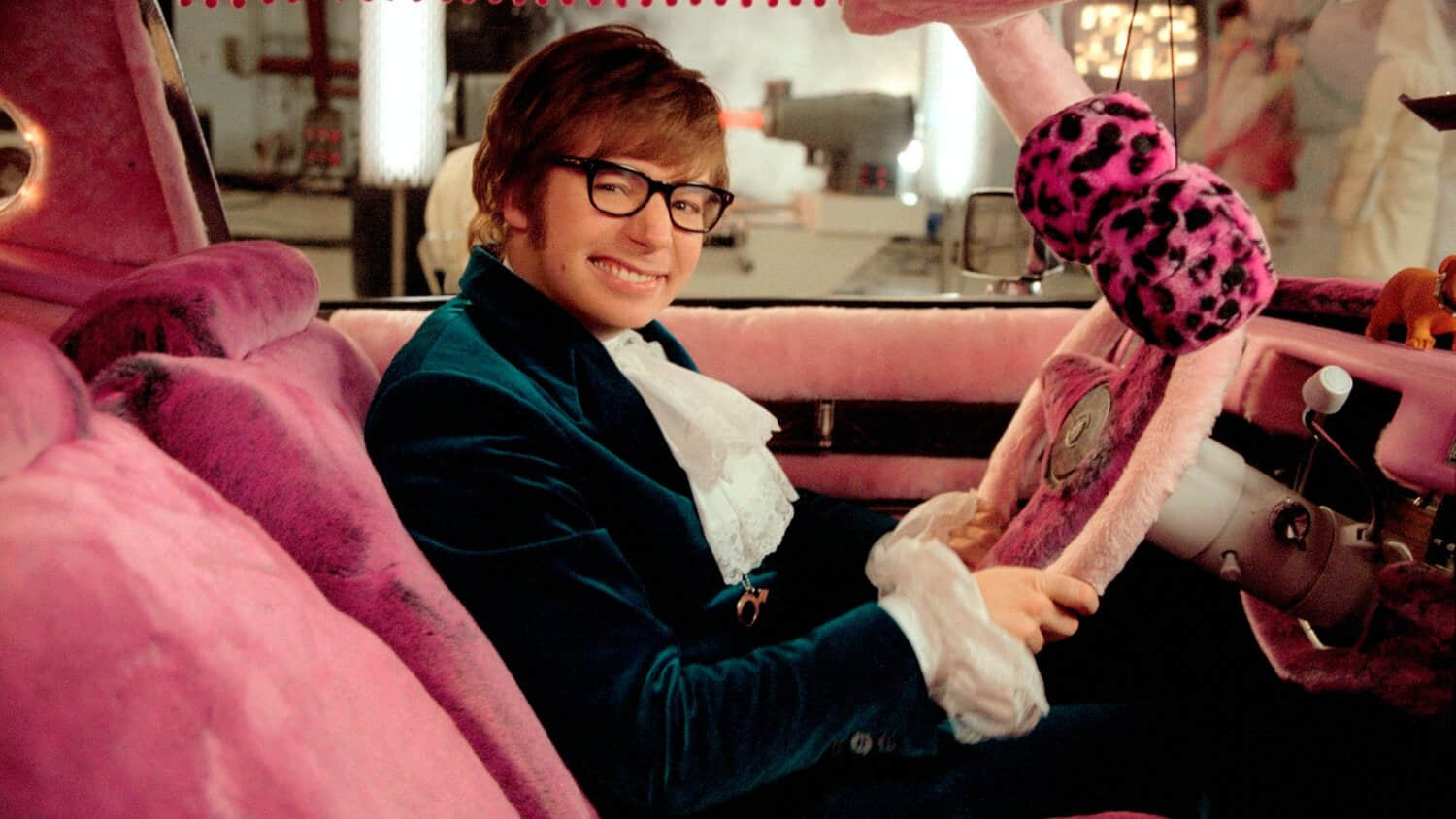mike-myers-as-austin-powers-in-a-pink-velvet-car-smiling-in-goldmember.jpeg