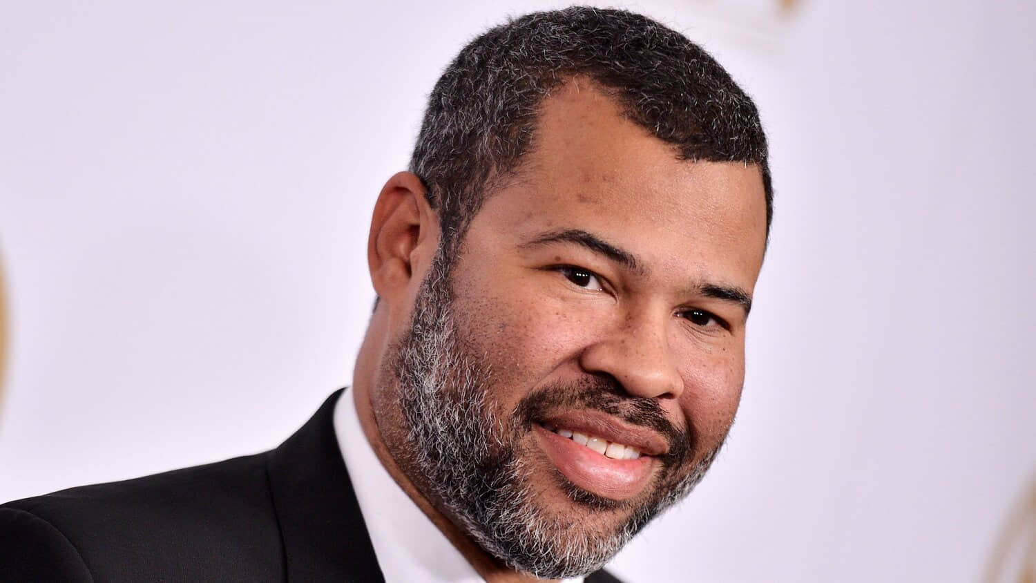 jordan-peele-smiling-at-the-30th-annual-producers-guild-awards.jpeg