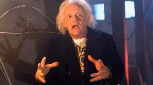 assets/christopher-lloyd-as-doc-brown-explaining-time-travel-in-back-to-the-future.jpeg