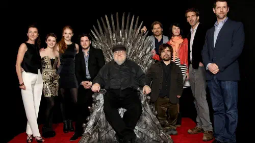assets/george-r-r-martin-with-the-cast-and-creators-of-game-of-thrones.jpeg