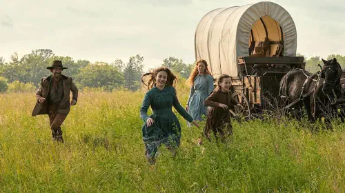 assets/a-family-running-through-the-fields-in-little-house-on-the-prairie.jpeg