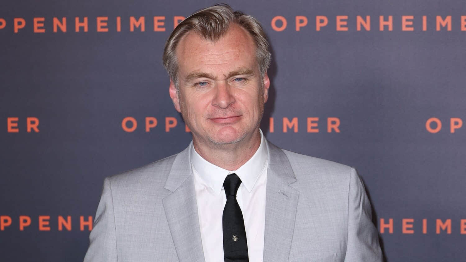 christopher-nolan-straight-faced-while-posing-at-a-red-carpet-event.jpeg