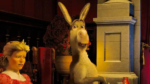 assets/donkey-sitting-up-awkwardly-next-to-the-queen-in-shrek-2.jpeg