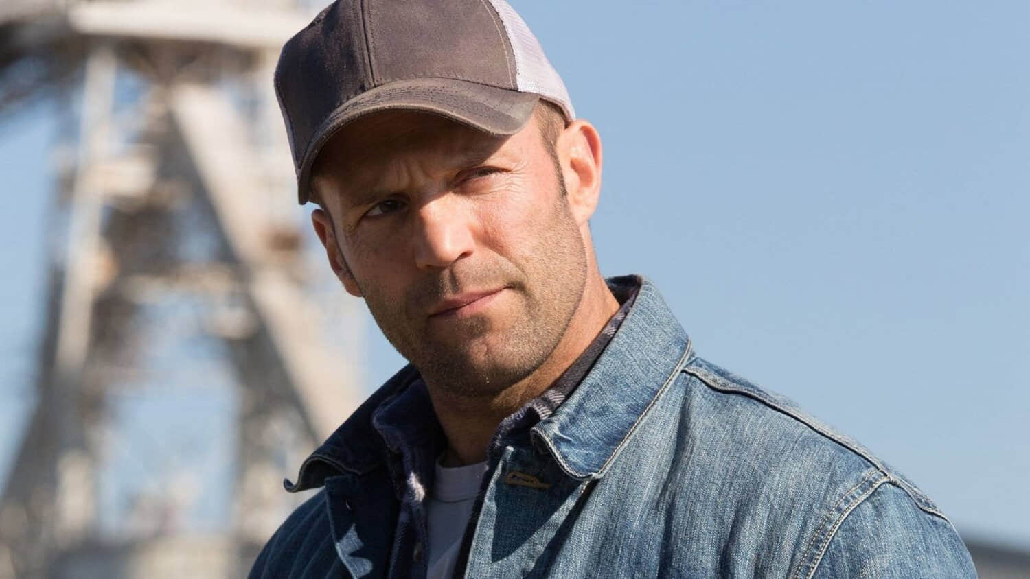 jason-statham-wearing-a-denim-jacket-and-baseball-hat-in-the-film-homefront.jpeg