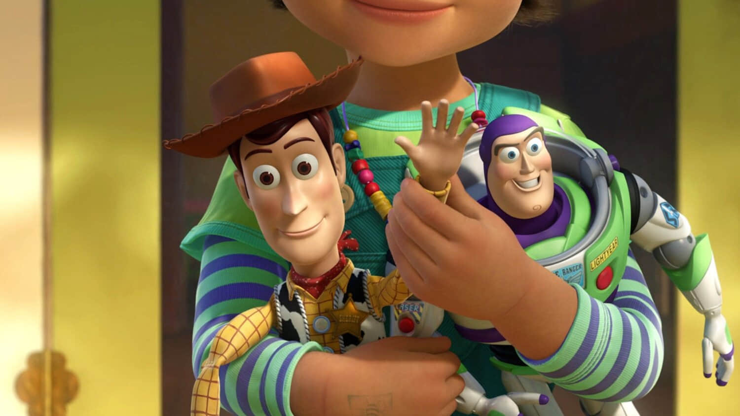 woody-waving-as-bonnie-holds-him-and-buzz-lightyear-in-toy-story-3.jpeg