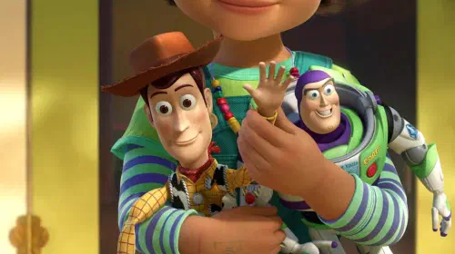 assets/woody-waving-as-bonnie-holds-him-and-buzz-lightyear-in-toy-story-3.jpeg