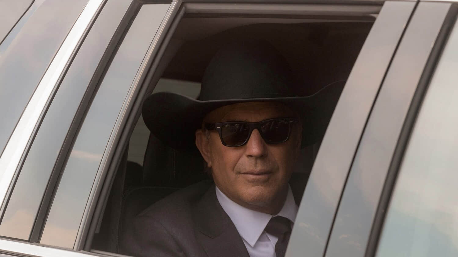 kevin-costner-s-john-dutton-sits-in-a-car-in-yellowstone.jpeg