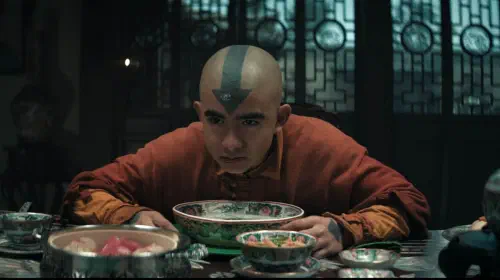 assets/aang-looking-up-from-his-soup-at-toph-in-netflix-s-avatar-the-last-airbender.jpeg