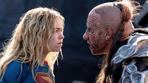 assets/millie-alcock-staring-down-matthias-schoenaerts-as-krem-in-supergirl-2026.jpeg