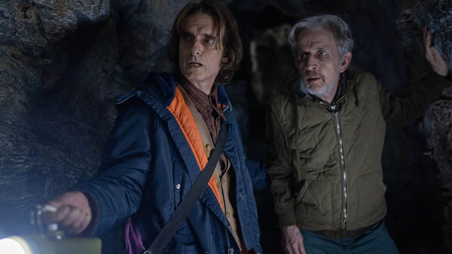 victor-and-henry-walking-through-the-caves-in-from-season-3-episode-6.jpeg