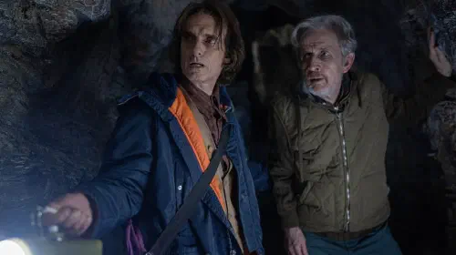 assets/victor-and-henry-walking-through-the-caves-in-from-season-3-episode-6.jpeg