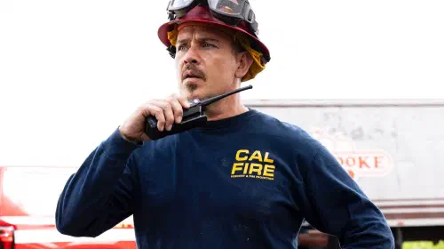 assets/kevin-alejandro-holding-a-walkie-talkie-and-looking-confused-in-fire-country.jpeg