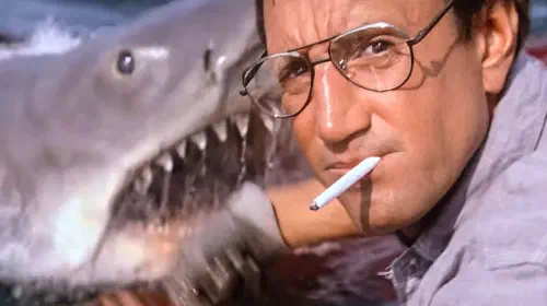 assets/a-shark-emerges-to-attack-roy-scheider-in-jaws-1975.jpeg