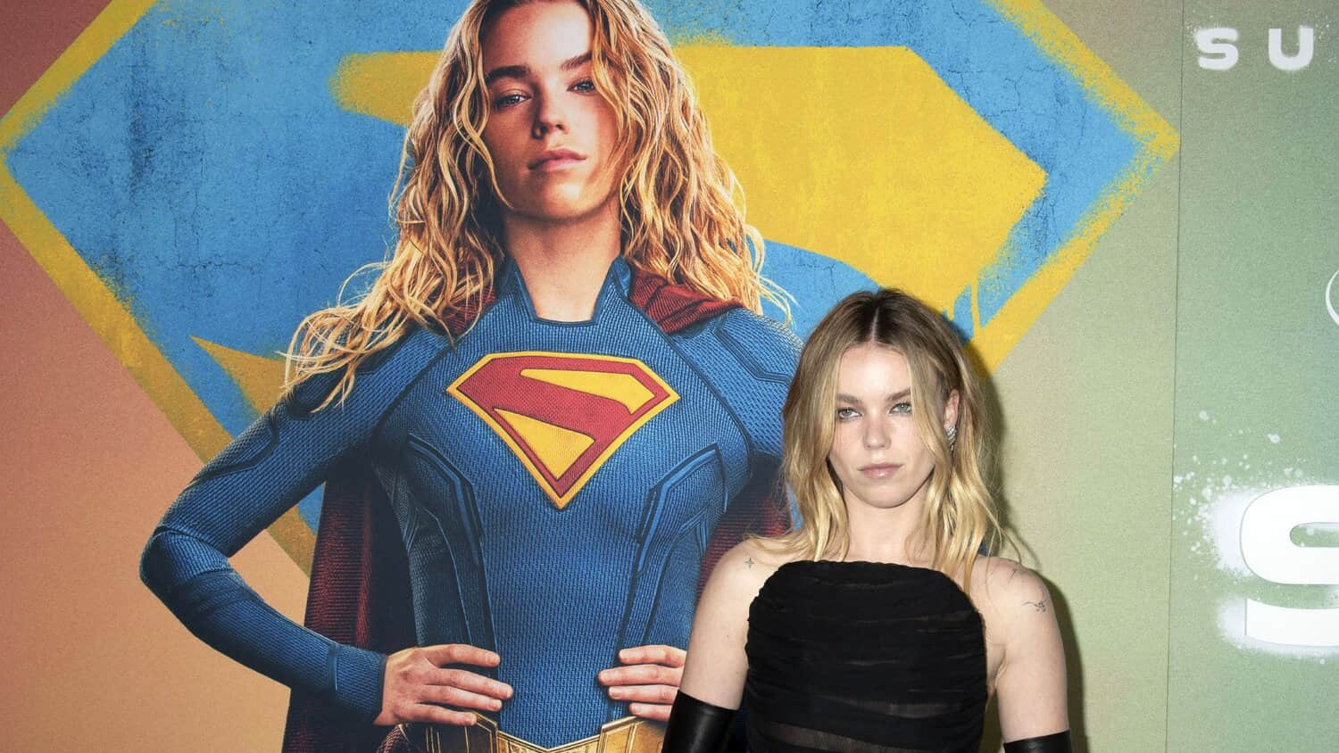 milly-alcock-posing-with-the-supergirl-poster.jpeg