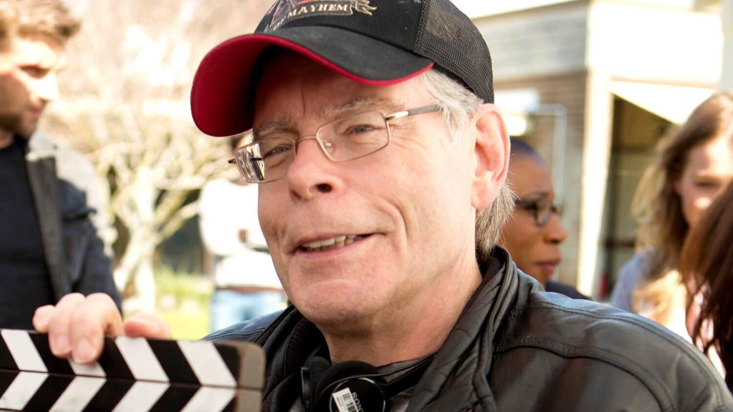stephen-king-holding-a-board-while-at-a-filming-location.jpeg