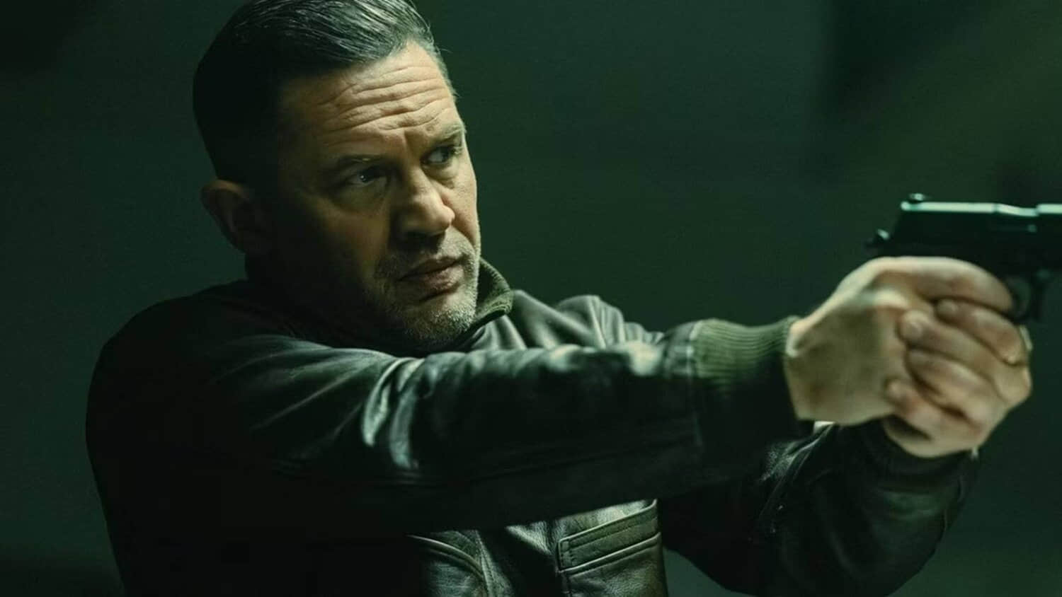 tom-hardy-as-harry-da-souza-holding-a-gun-in-mobland.jpeg