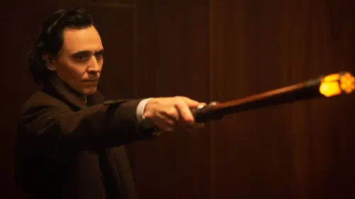 assets/loki-holding-a-time-stick-and-pointing-it-at-someone-in-loki.jpeg