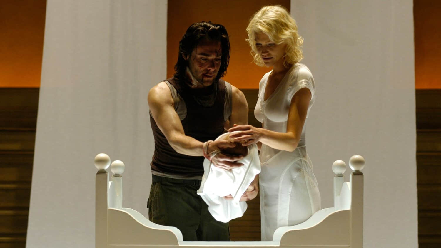 gaius-and-six-holding-a-baby-in-battlestar-galactica.jpeg