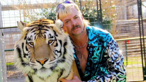 assets/tiger-king-still-featuring-joe-exotic-and-a-tiger.jpeg