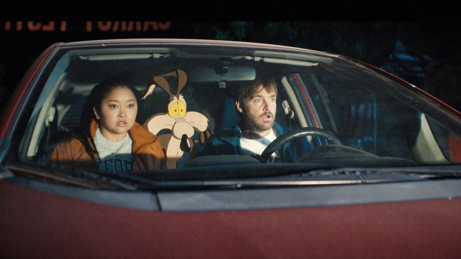 lana-condor-and-will-forte-in-a-car-with-wile-e-coyote-in-coyote-vs-acme.jpeg