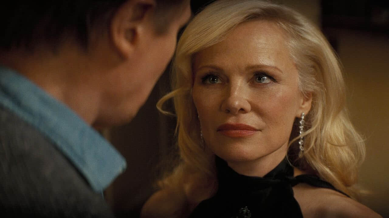 pamela-anderson-looking-up-at-liam-neeson-in-the-naked-gun-video.jpeg