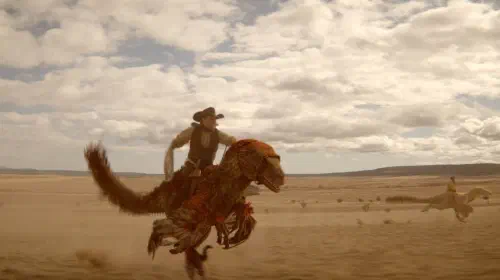 assets/dinosaurs-of-the-wild-west-cowboy-riding-raptor.jpeg